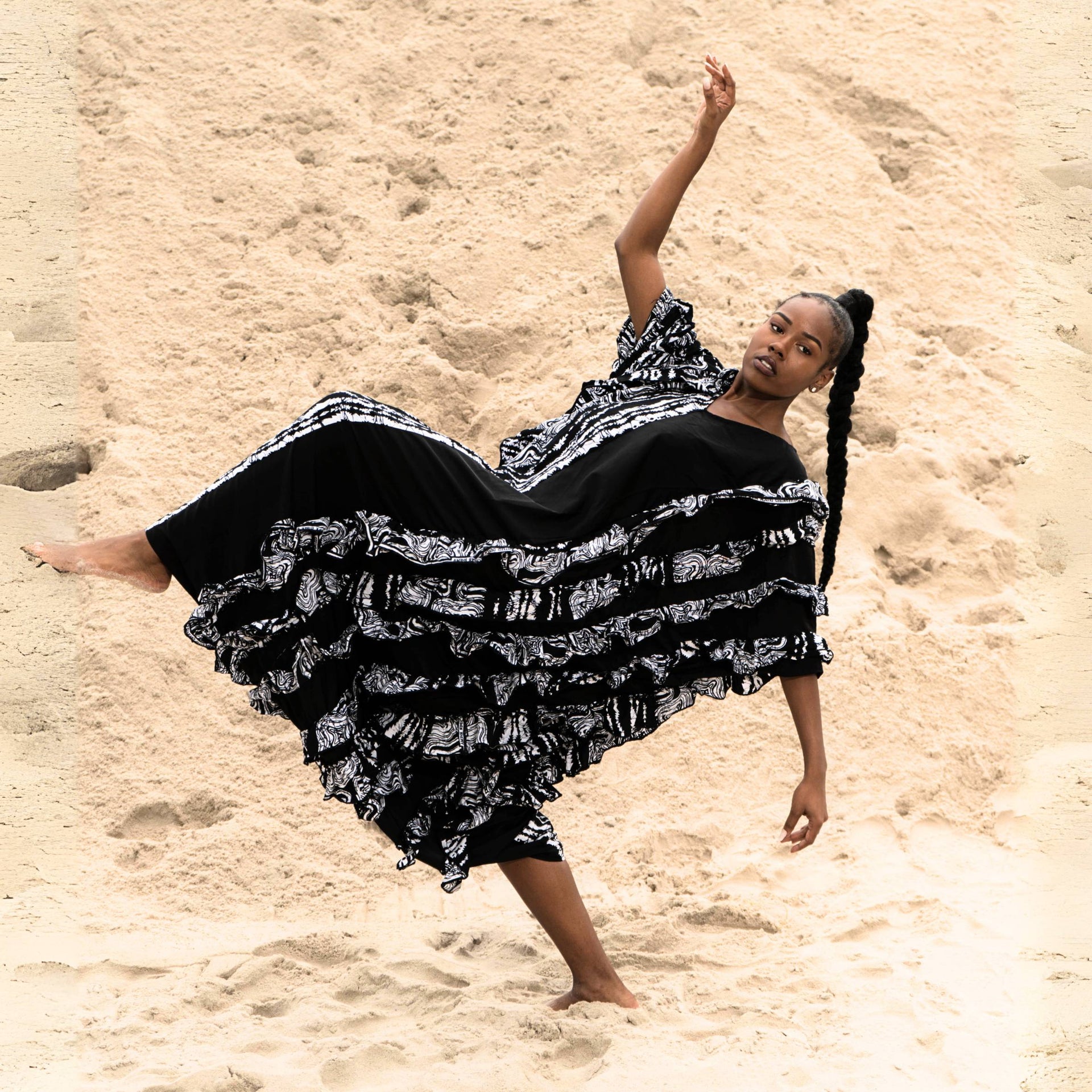 Close-up of Ologo kaftan’s ruffled textures and intricate Ankara-satin fabric blend